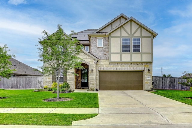 4910 Magnolia Springs Dr, Pearland, TX 77584 - english style home featuring fence, stone siding, and a garage