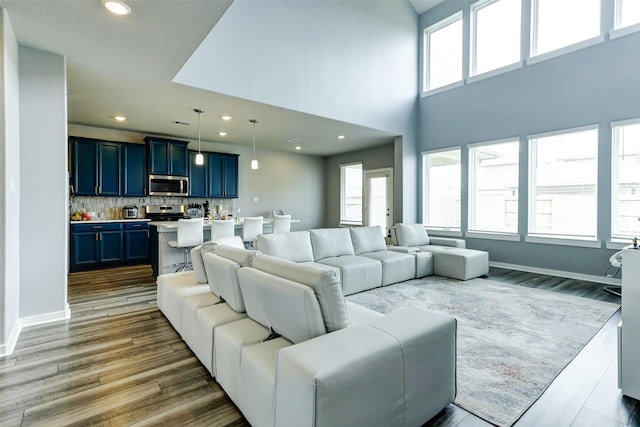 4910 Magnolia Springs Dr, Pearland, TX 77584 - living room featuring recessed lighting and wood finished floors