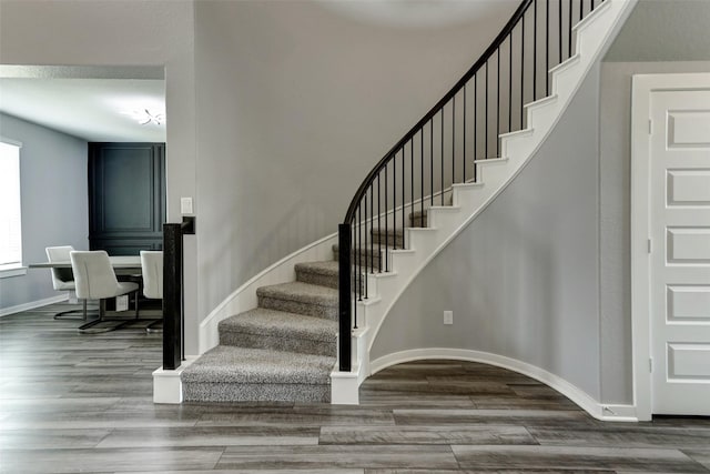 4910 Magnolia Springs Dr, Pearland, TX 77584 - stairs with baseboards and wood finished floors