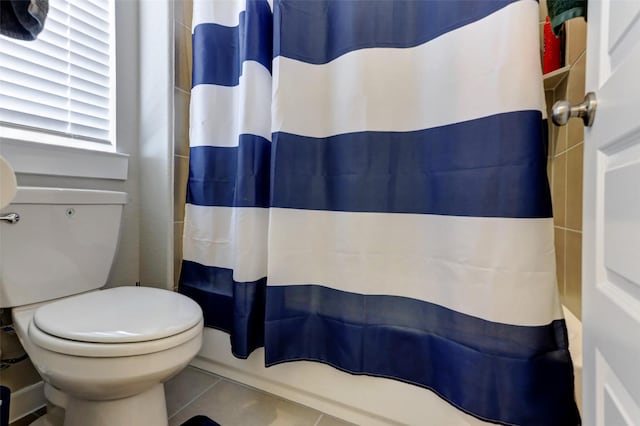 4910 Magnolia Springs Dr, Pearland, TX 77584 - full bathroom featuring toilet, curtained shower, and tile patterned flooring