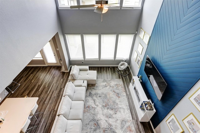 4910 Magnolia Springs Dr, Pearland, TX 77584 - living room featuring a high ceiling, ceiling fan, and wood finished floors