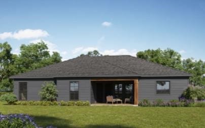 back of house with a yard