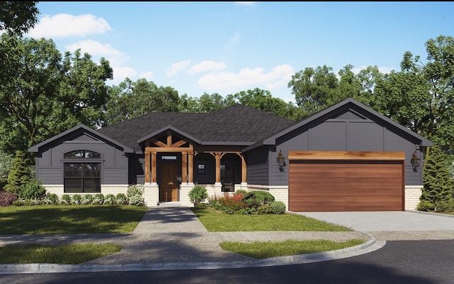 view of front of property with a front yard, roof with shingles, brick siding, an attached garage, and driveway