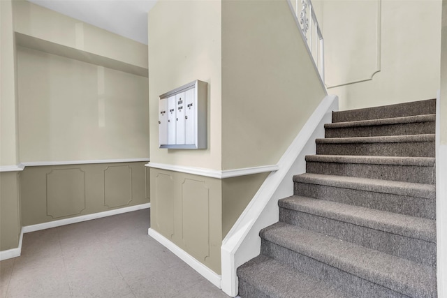 386 N Post Oak Ln, Houston, TX 77024 - stairway featuring baseboards
