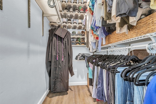 386 N Post Oak Ln, Houston, TX 77024 - spacious closet with wood finished floors