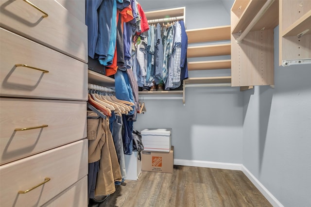 386 N Post Oak Ln, Houston, TX 77024 - walk in closet featuring wood finished floors