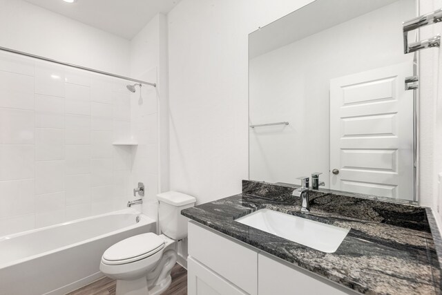 2811 Gran Castillo Dr, Texas City, TX 77568 - full bathroom with wood finished floors, vanity, and shower / washtub combination