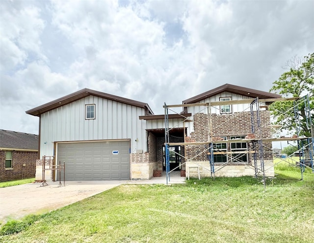 119 N 8th St, Beasley, TX 77417 - view of front of house featuring a garage, board and batten siding, and concrete driveway