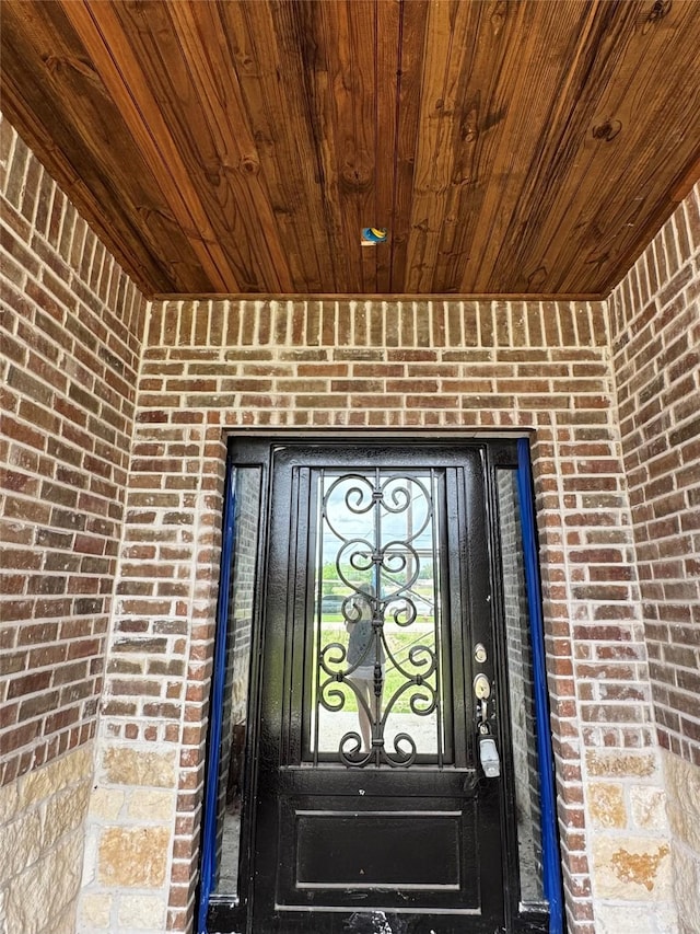 119 N 8th St, Beasley, TX 77417 - property entrance featuring brick siding