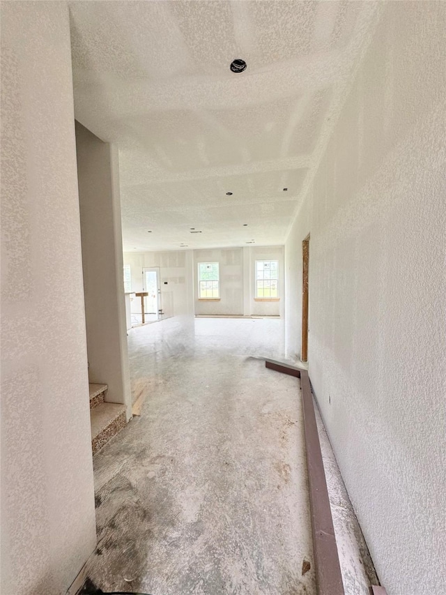 119 N 8th St, Beasley, TX 77417 - hallway featuring a textured ceiling, a textured wall, and stairway