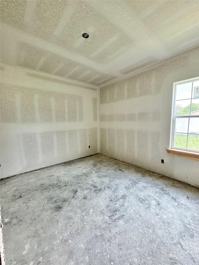 119 N 8th St, Beasley, TX 77417 - spare room featuring a textured ceiling and unfinished concrete flooring