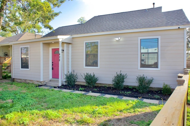 ranch-style house with a front lawn and entry steps