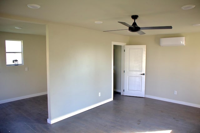 empty room featuring an AC wall unit, baseboards, dark wood-style floors, and ceiling fan
