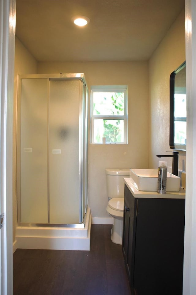 full bath with vanity, toilet, recessed lighting, and a stall shower