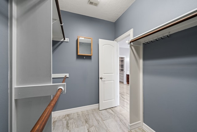 spacious closet with visible vents