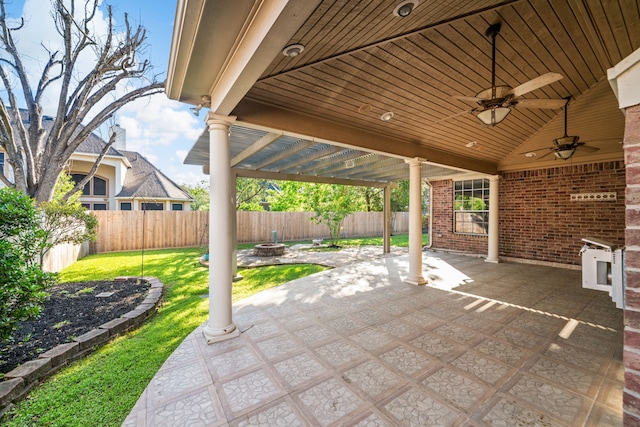 view of patio / terrace featuring ceiling fan, a fenced backyard, and an outdoor fire pit