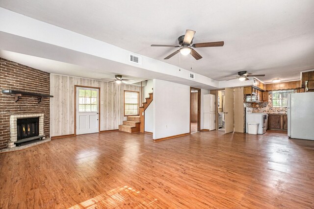 189 Lake Livingston Blvd, Livingston, TX 77351 - unfurnished living room featuring visible vents, ceiling fan, and light wood-type flooring