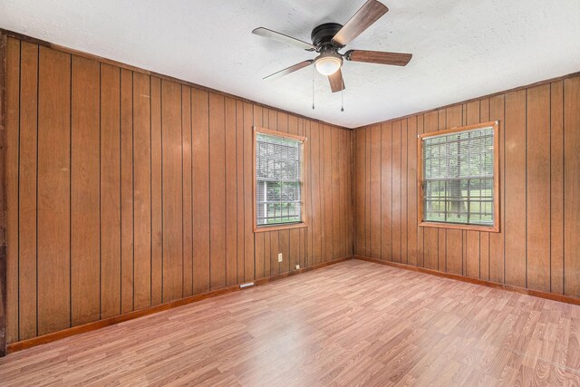 189 Lake Livingston Blvd, Livingston, TX 77351 - unfurnished room with baseboards, a textured ceiling, ceiling fan, and wood finished floors