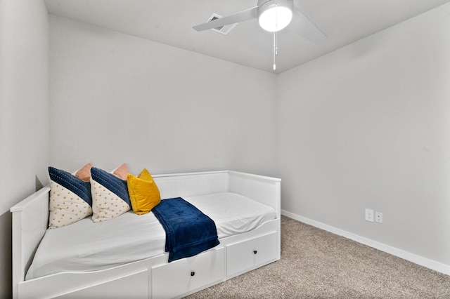 unfurnished bedroom with baseboards, carpet flooring, and ceiling fan