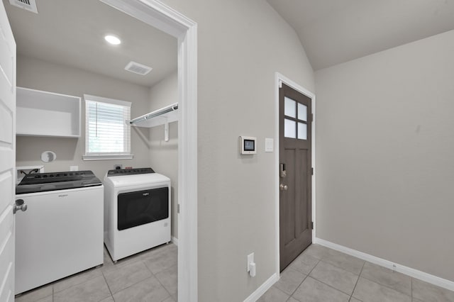 17422 Buckeye Br, Conroe, TX 77385 - washroom with washing machine and dryer, light tile patterned floors, and baseboards