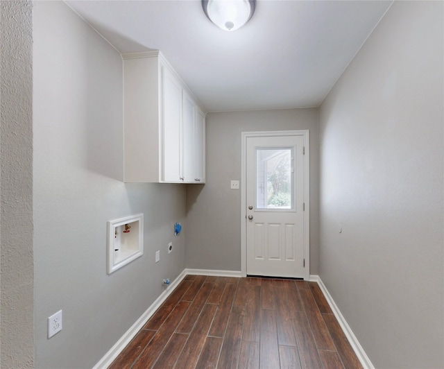 laundry area with baseboards, hookup for a washing machine, dark wood-style flooring, and cabinet space