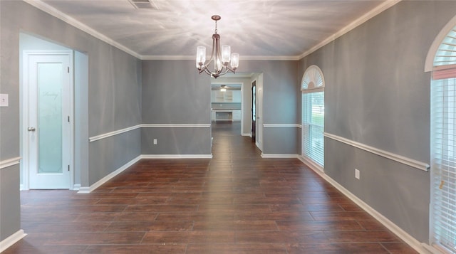 unfurnished dining area featuring an inviting chandelier, ornamental molding, baseboards, and wood finished floors