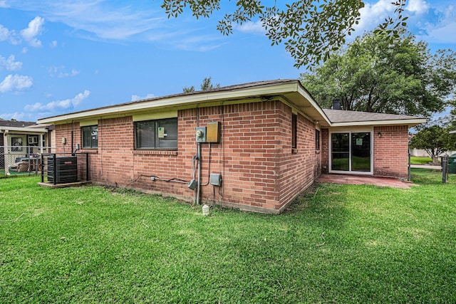 12719 Panay Dr, Houston, TX 77048 - view of property exterior with a yard, brick siding, and fence