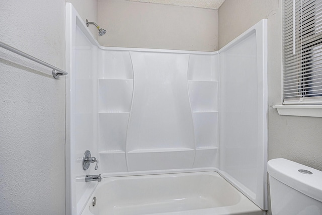 12719 Panay Dr, Houston, TX 77048 - bathroom with a textured wall, bathtub / shower combination, and toilet