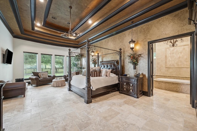 bedroom with stone tile floors, crown molding, a chandelier, and a tray ceiling