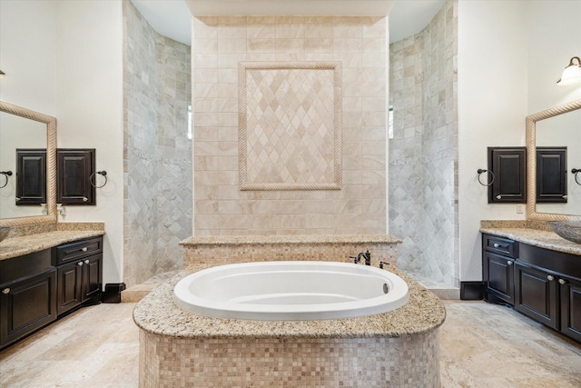 bathroom with a bath and vanity