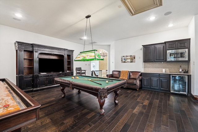 game room with beverage cooler, billiards, dark wood finished floors, and bar area