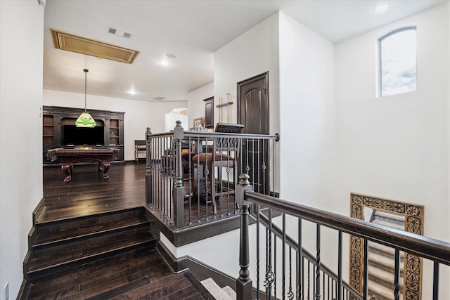 staircase with visible vents, attic access, wood-type flooring, and recessed lighting