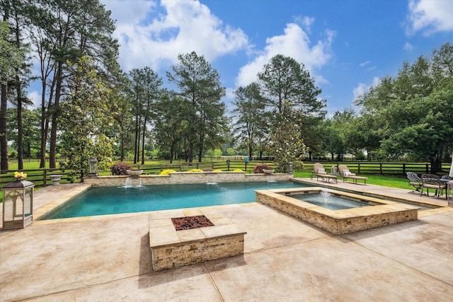 outdoor pool with a patio, a fenced backyard, an in ground hot tub, and a fire pit