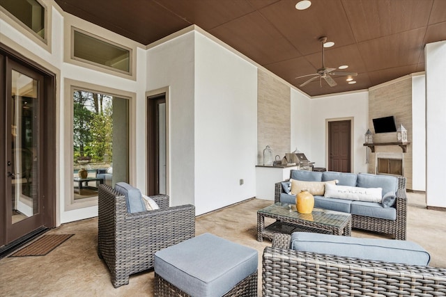 view of patio featuring an outdoor hangout area, a ceiling fan, and an outdoor kitchen