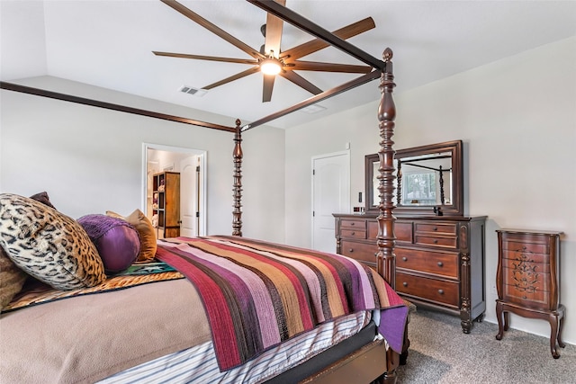bedroom featuring visible vents, a ceiling fan, carpet, and vaulted ceiling
