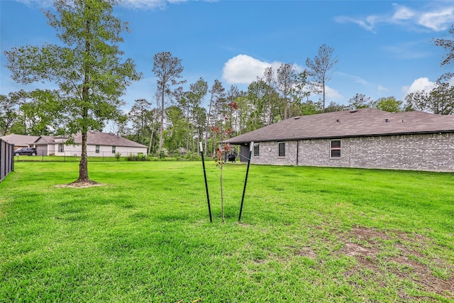 view of yard with fence