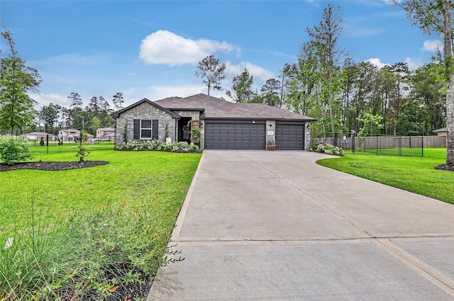 ranch-style house with a garage, a front lawn, fence, and driveway