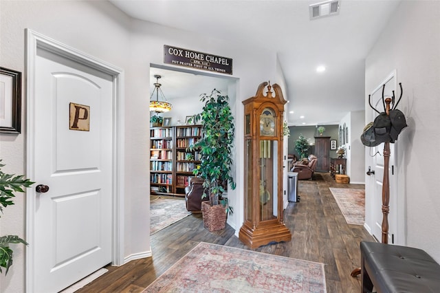 corridor featuring baseboards, dark wood-type flooring, recessed lighting, and visible vents