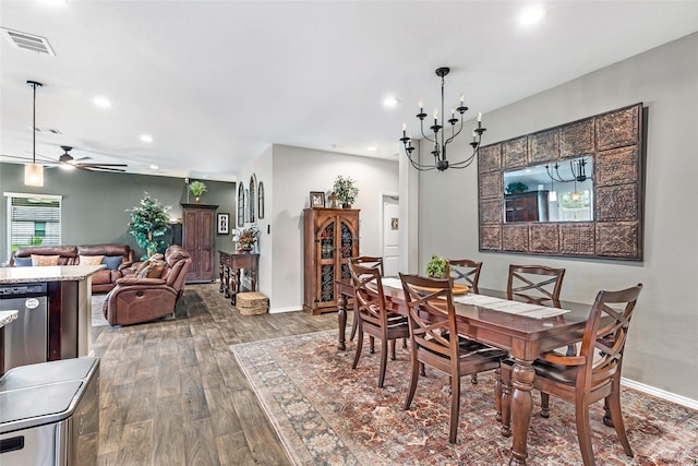 dining area with recessed lighting, visible vents, wood finished floors, and ceiling fan with notable chandelier