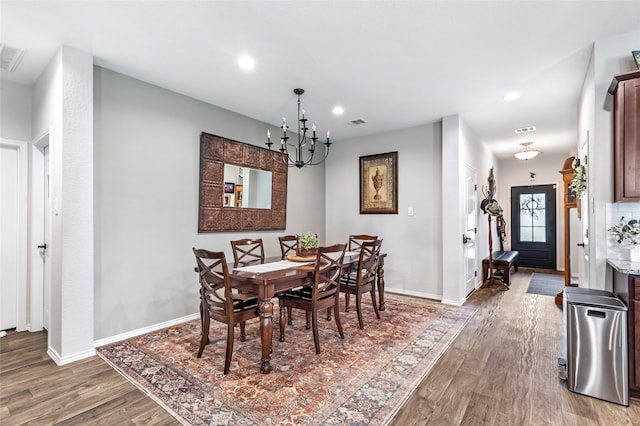 dining room featuring visible vents, wood finished floors, baseboards, recessed lighting, and a notable chandelier