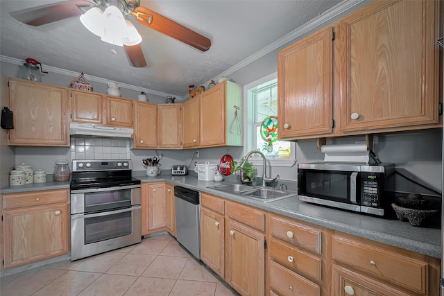 kitchen featuring crown molding, light tile patterned flooring, a sink, stainless steel appliances, and under cabinet range hood