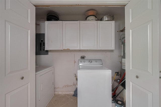 clothes washing area featuring light tile patterned floors, electric panel, cabinet space, and washer and dryer