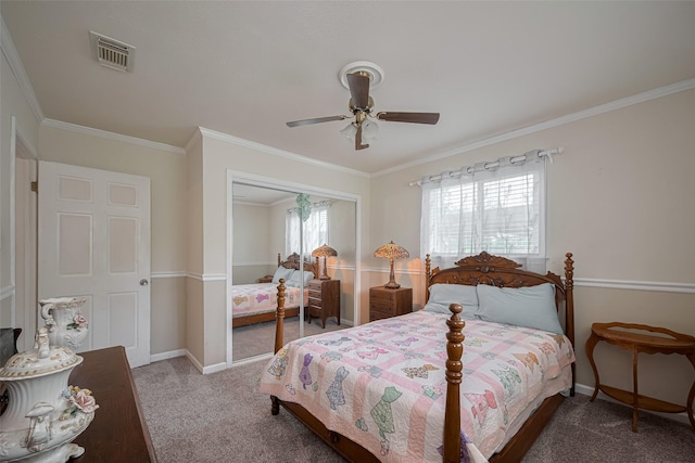 bedroom featuring visible vents, crown molding, baseboards, a closet, and carpet