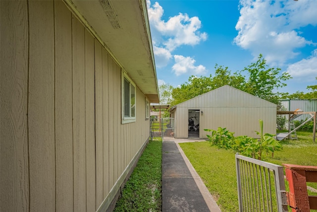 view of yard featuring fence and an outdoor structure