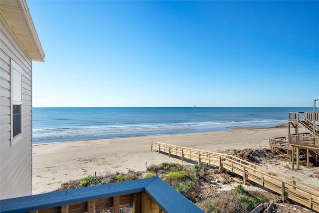 water view with a beach view and fence