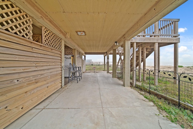 view of patio featuring fence