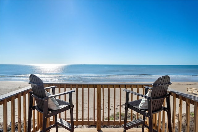 exterior space with a water view and a view of the beach