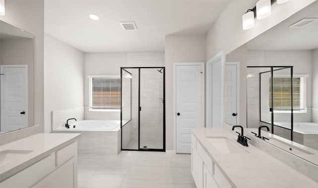 2617 Bisbee Rd, League City, TX 77573 - bathroom with two vanities, a bath, a shower stall, tile patterned flooring, and recessed lighting