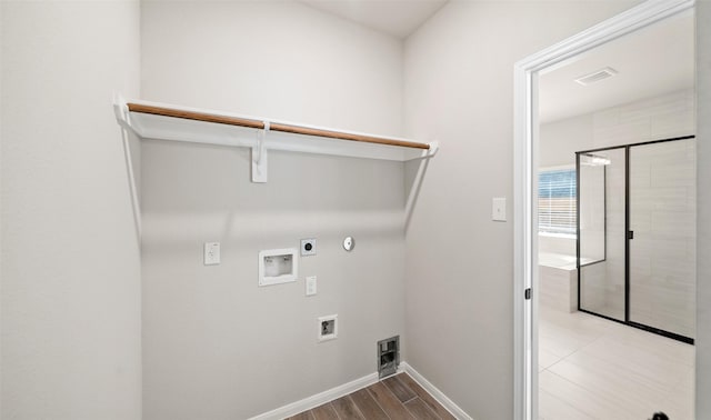 2617 Bisbee Rd, League City, TX 77573 - laundry area with electric dryer hookup, hookup for a washing machine, baseboards, gas dryer hookup, and wood finished floors