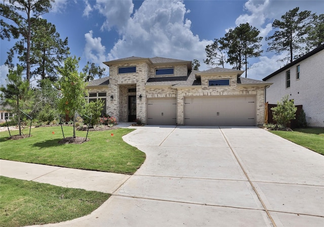 12944 Whitewater Way, Conroe, TX 77302 - view of front facade with driveway, brick siding, a front lawn, a garage, and a shingled roof
